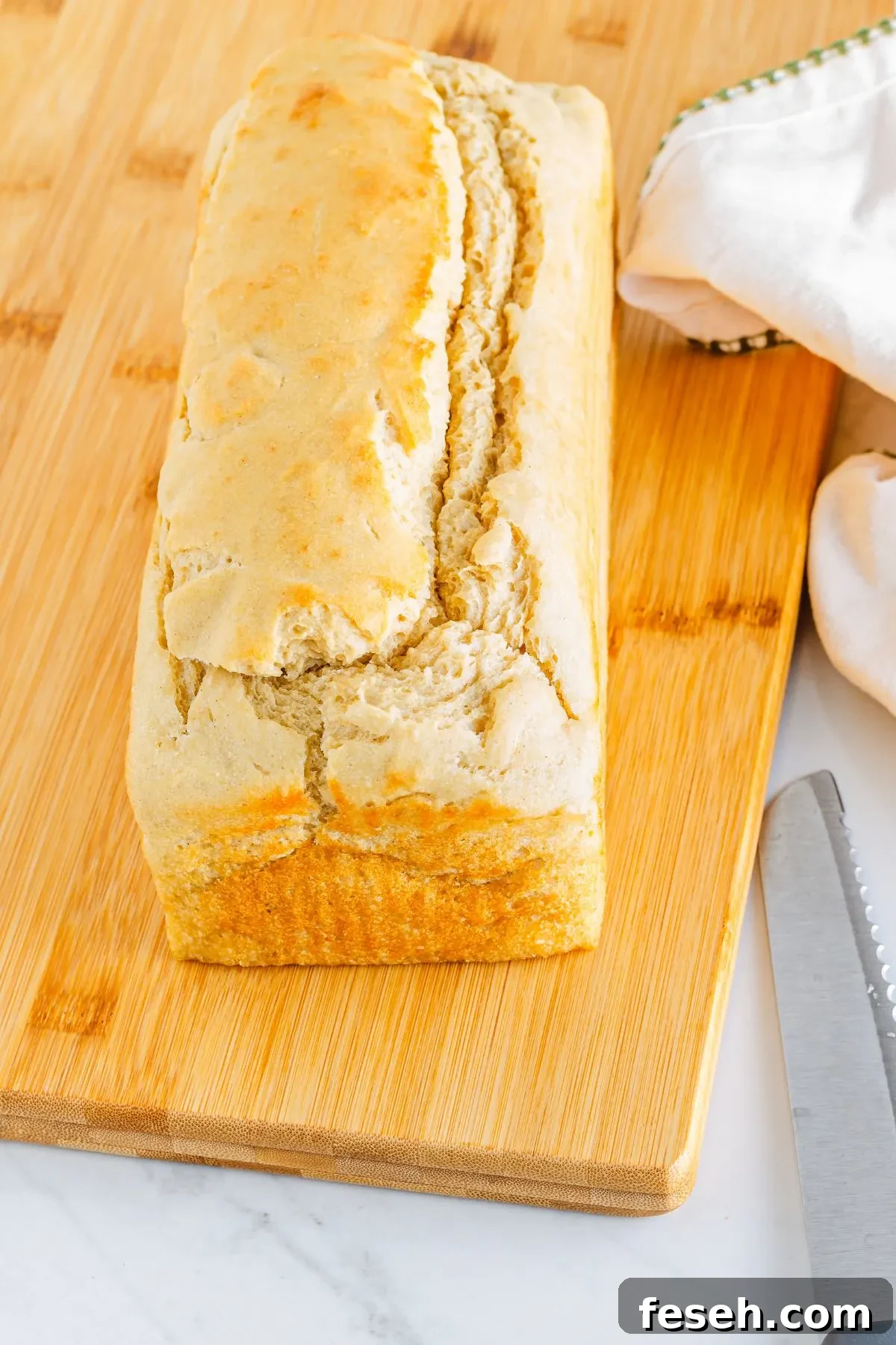 A fresh baked loaf of gluten free dairy free soy free white bread.