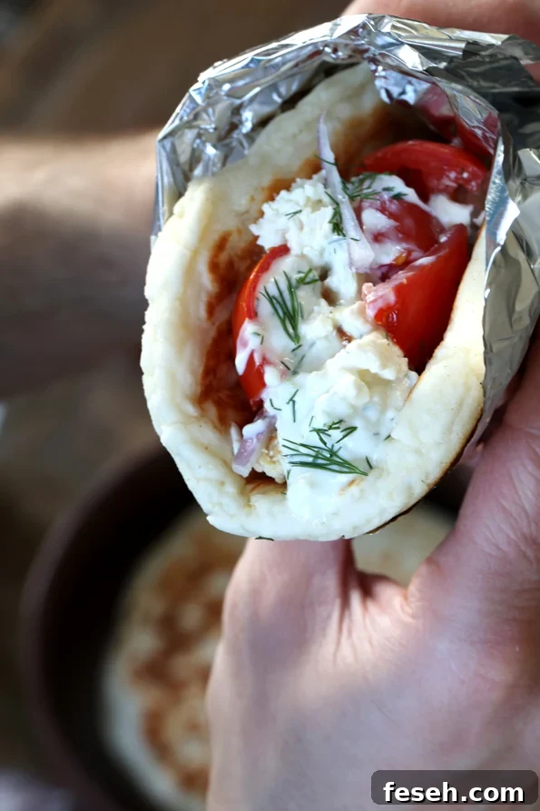 Close up of chicken gyros being held