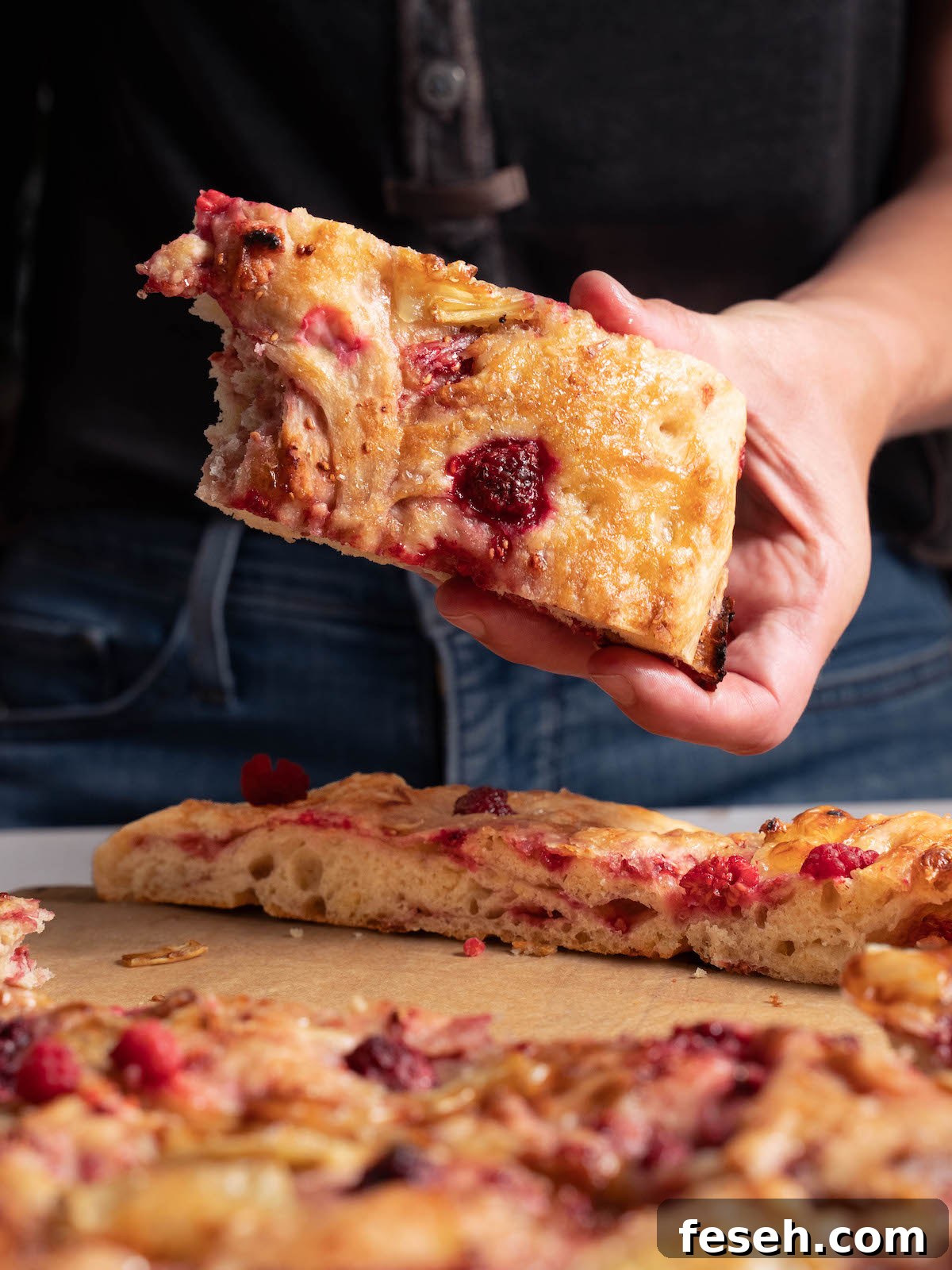 The top of a loaf of raspberry focaccia bread