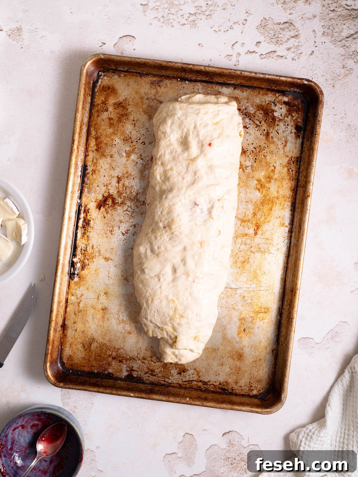 Raspberry brie focaccia rolled into a log shape