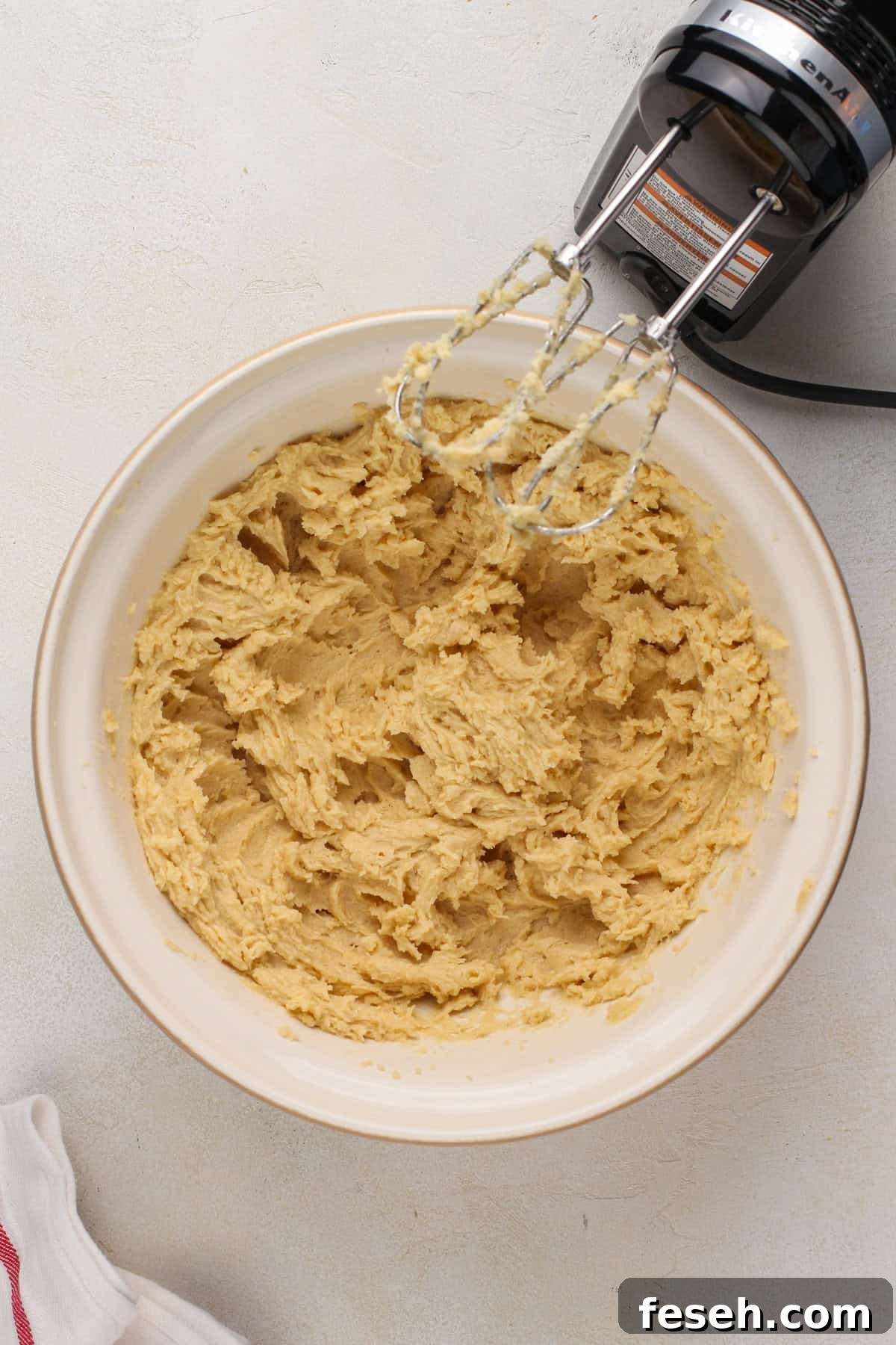 Wet ingredients for salted caramel chocolate chip cookies mixed in a mixing bowl.