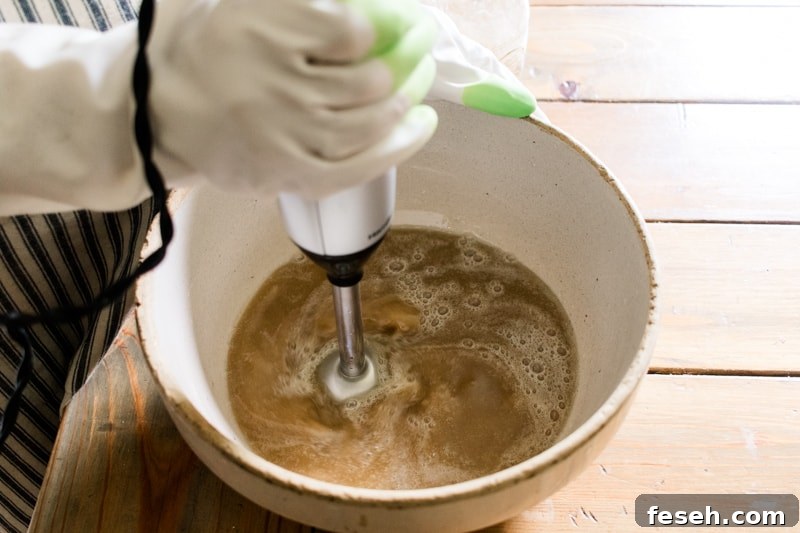 Mixing cold process coffee soap with an immersion blender.
