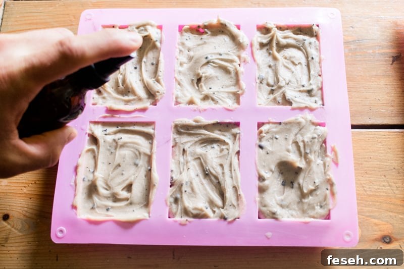 Spritzing coffee soap in the mold.
