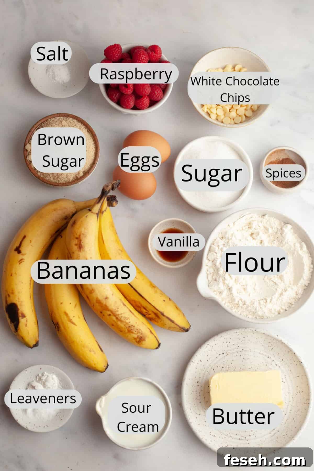All the ingredients needed to make raspberry banana muffins, weighed out into small bowls.