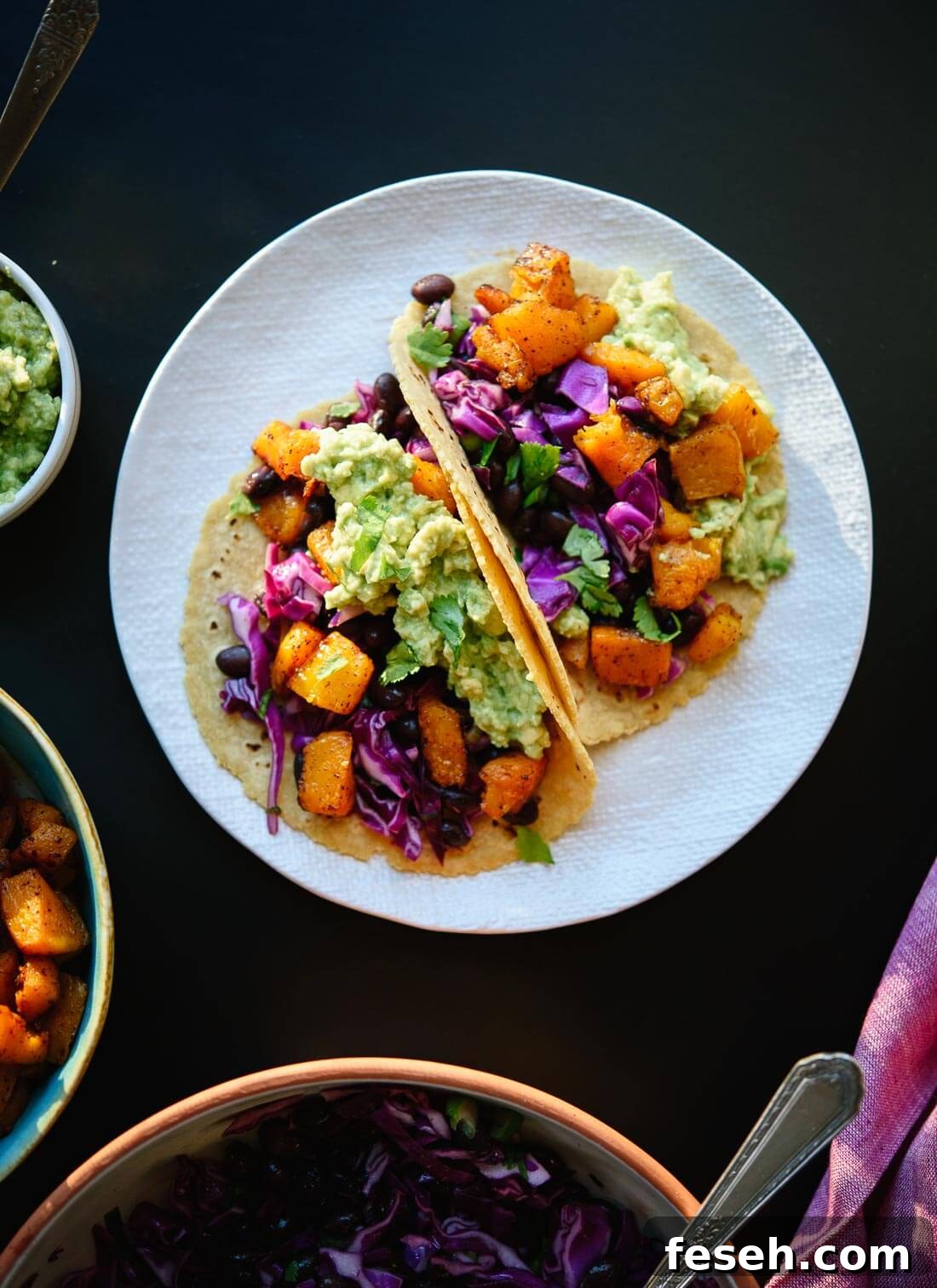 Roasted butternut squash tacos with guacamole! Vegan and gluten free. cookieandkate.com