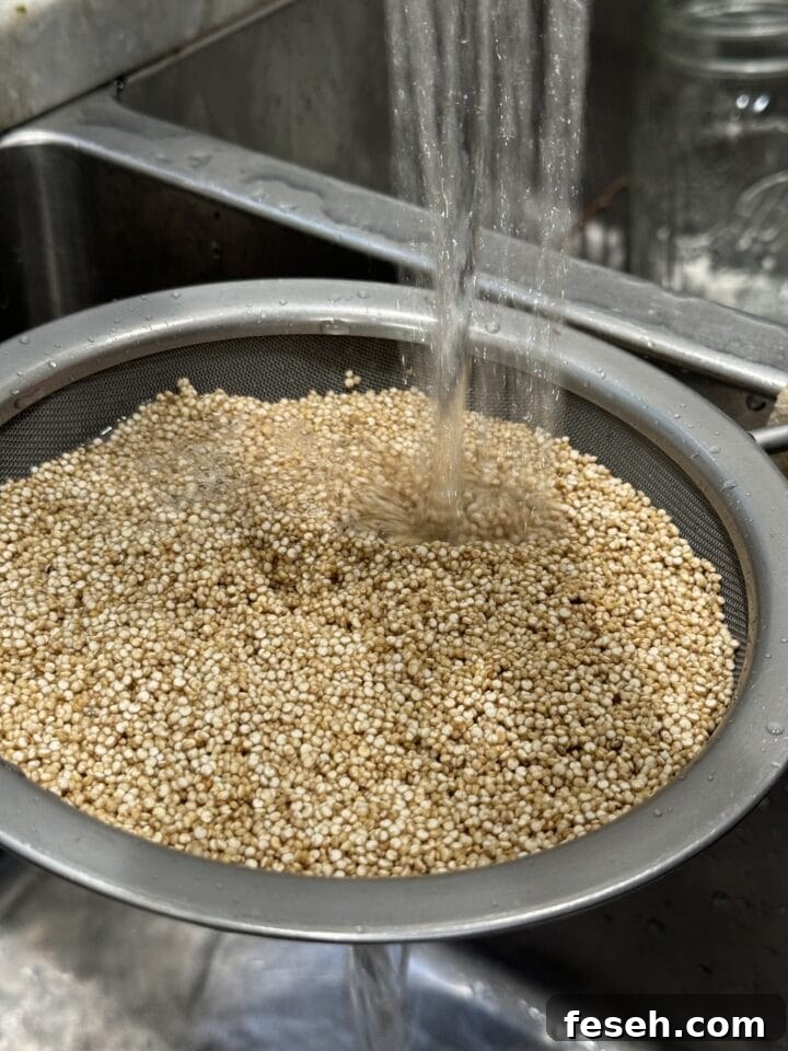 a photo of rinsing quinoa in a strainer