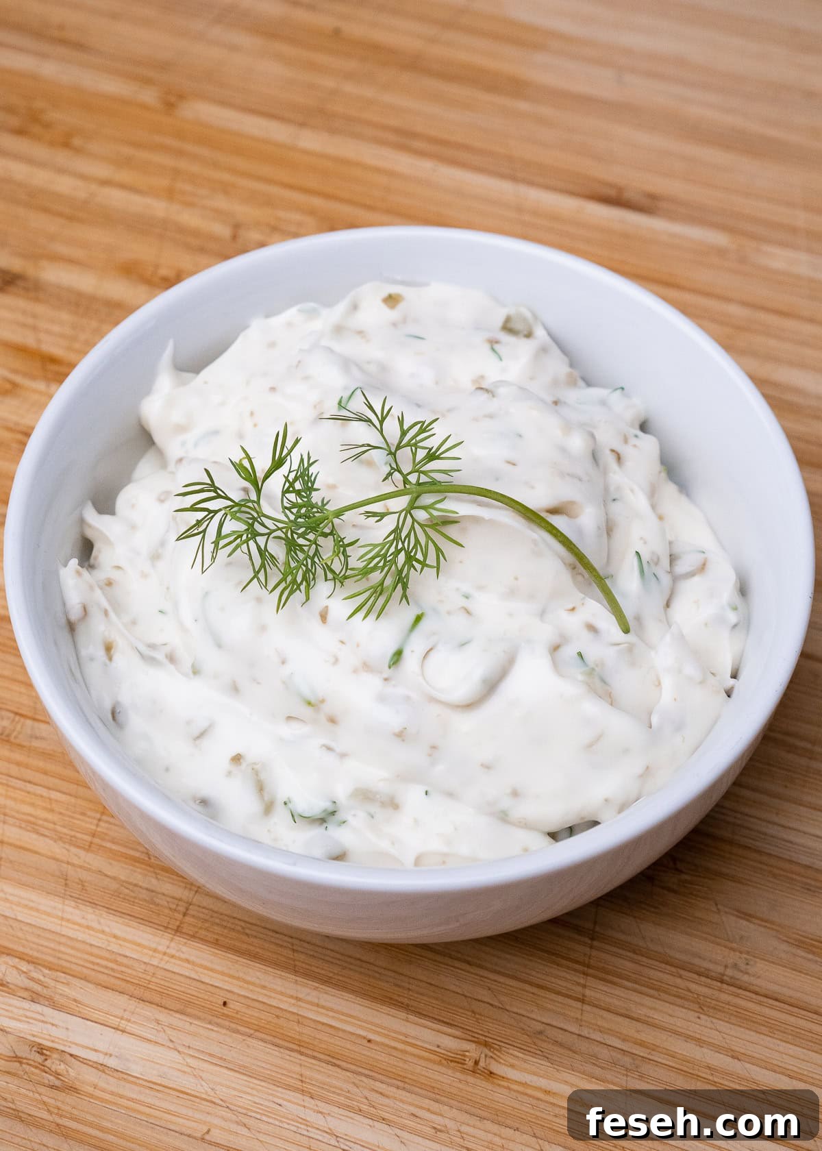 Tartare Sauce served in a bowl with dill on top
