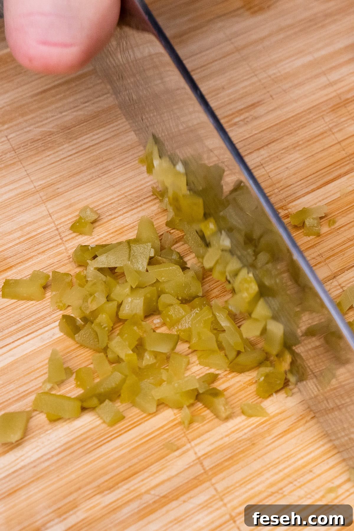 Chopping up a Gerkin on a chopping board