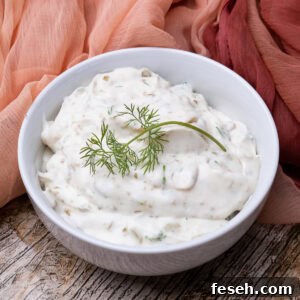 Homemade tartare sauce served in a bowl with dill on top