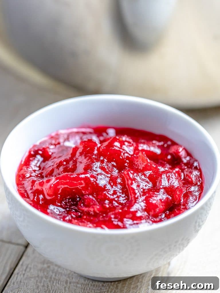 homemade cranberry sauce with maple syrup in a white bowl