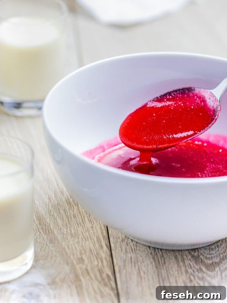 homemade cranberry sauce with maple syrup in bowl with spoon