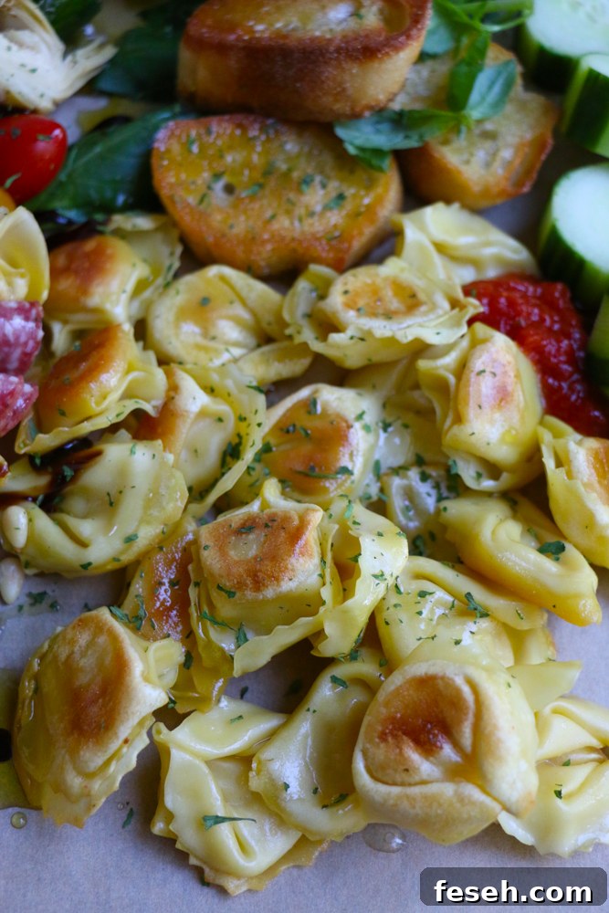 Tortellinis, vegetables, and slices of bread.