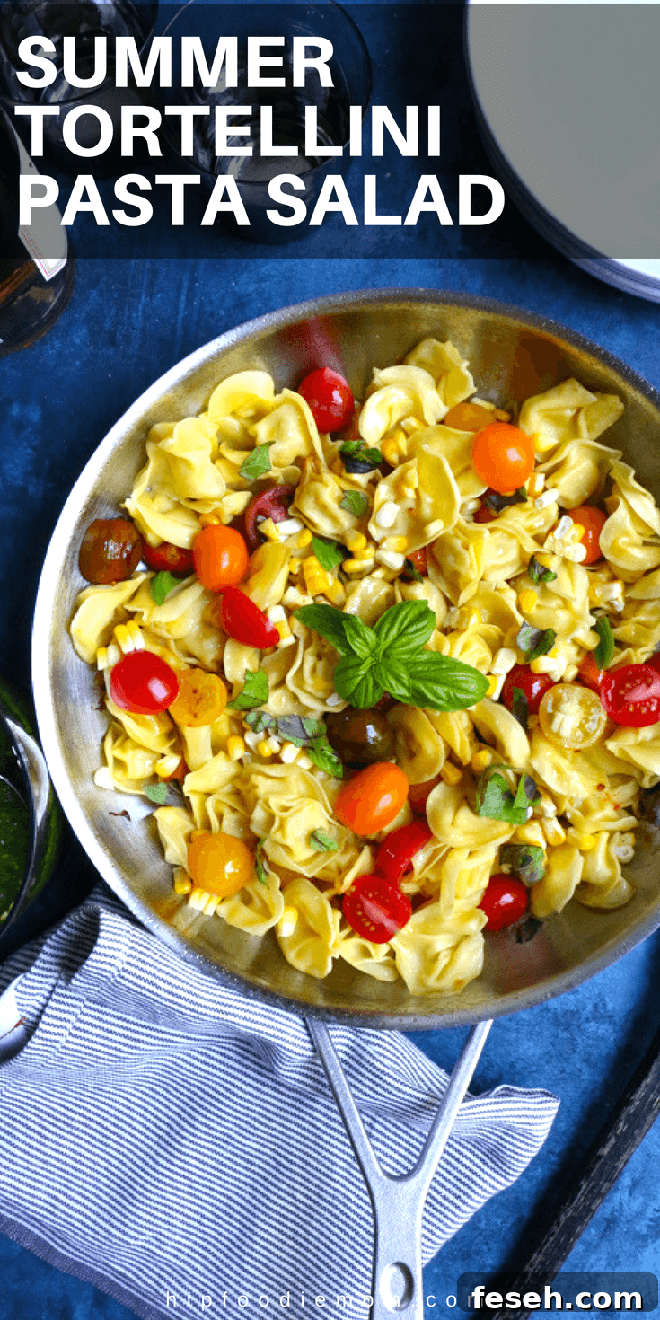 Summer Tortellini Pasta Salad! Pan fried five cheese tortellini cooked with cherry tomatoes, corn and a spinach pesto!