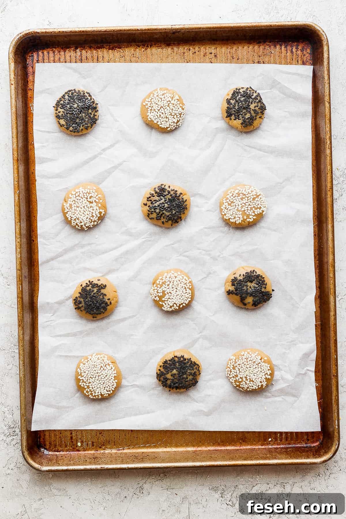 sesame sesame cookies on a baking sheet.