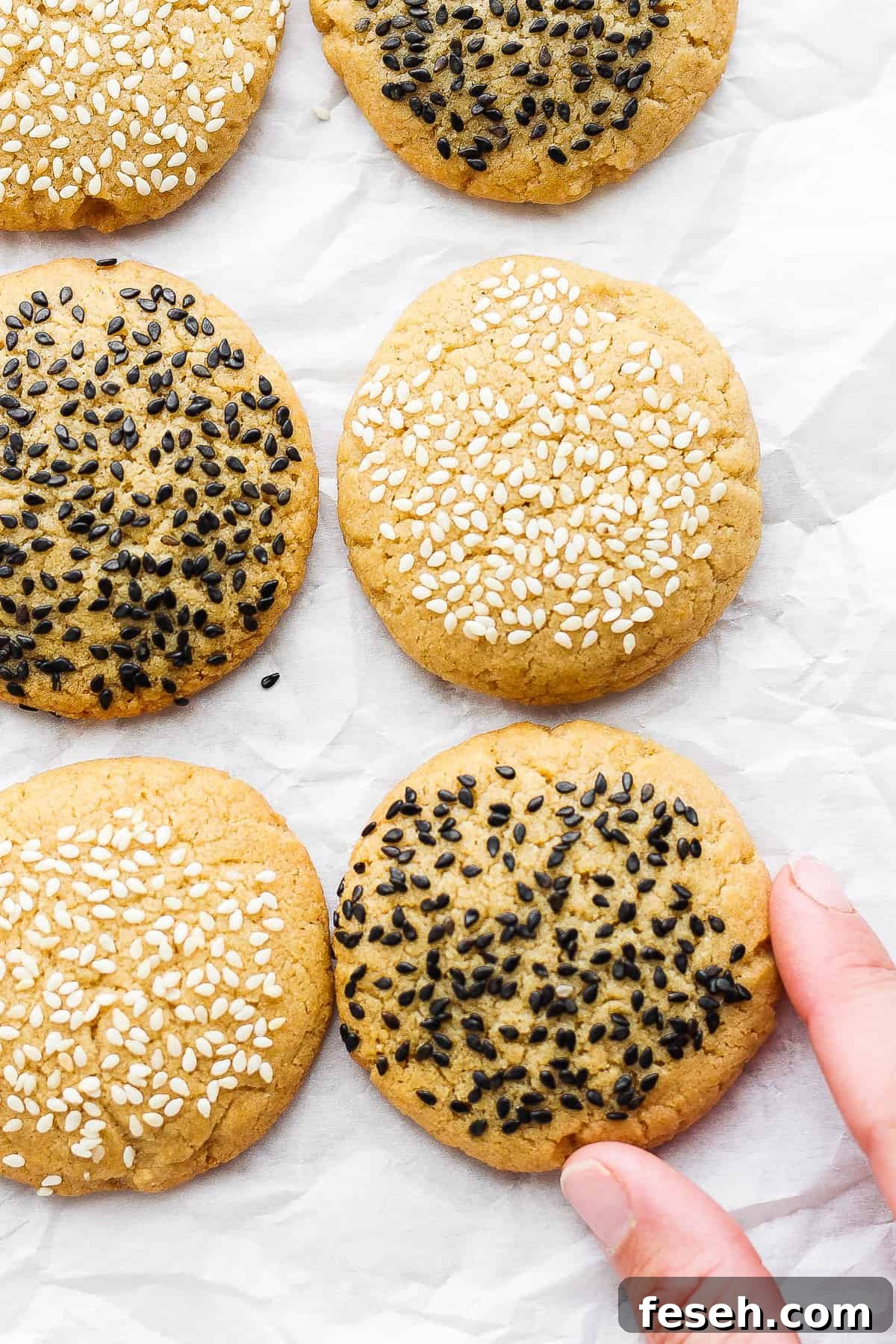 sesame cookies with sesame seeds on top.