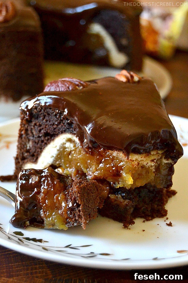 A gooey bite of chocolate pecan piecaken on a fork and a plate