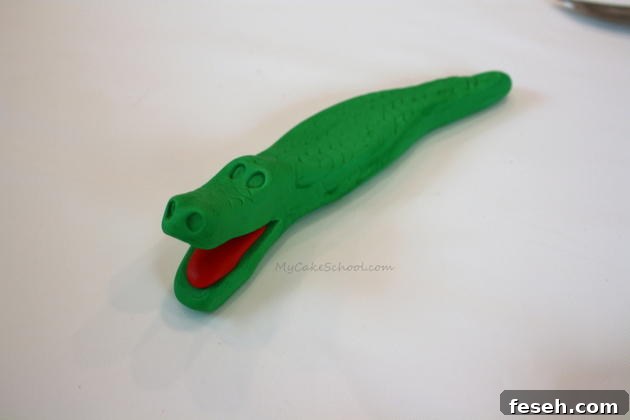 Alligator Swamp Party Cake! Learn to model CUTE alligators in this free cake decorating tutorial by MyCakeSchool.com!