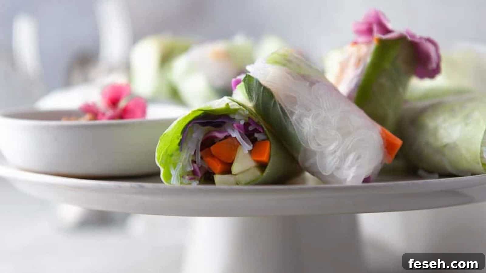 Low angle shot of vietnamese summer rolls with edible flowers.