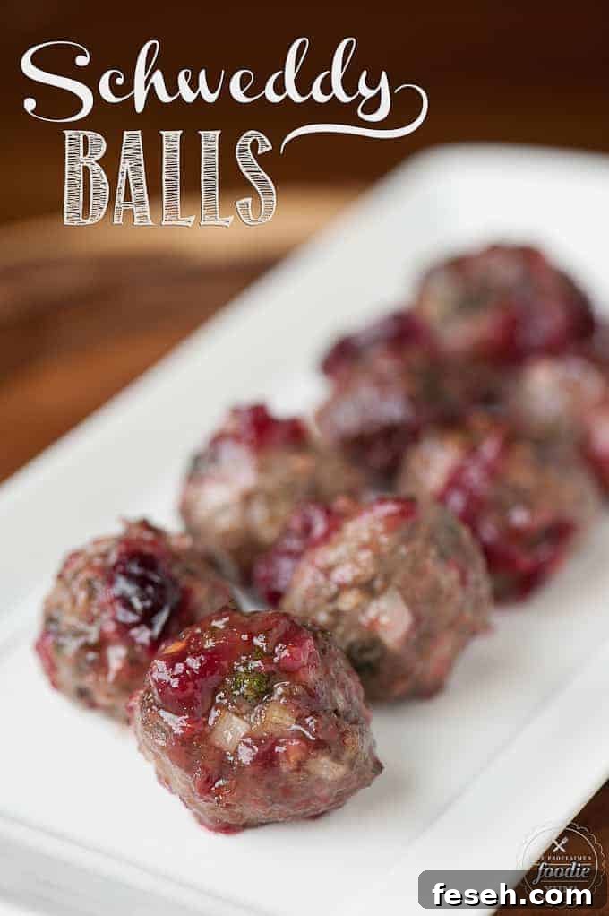 a platter of beef cocktail meatballs with cranberry sauce