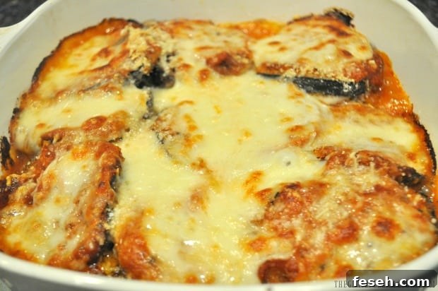 Freshly baked eggplant parmesan with melted cheese