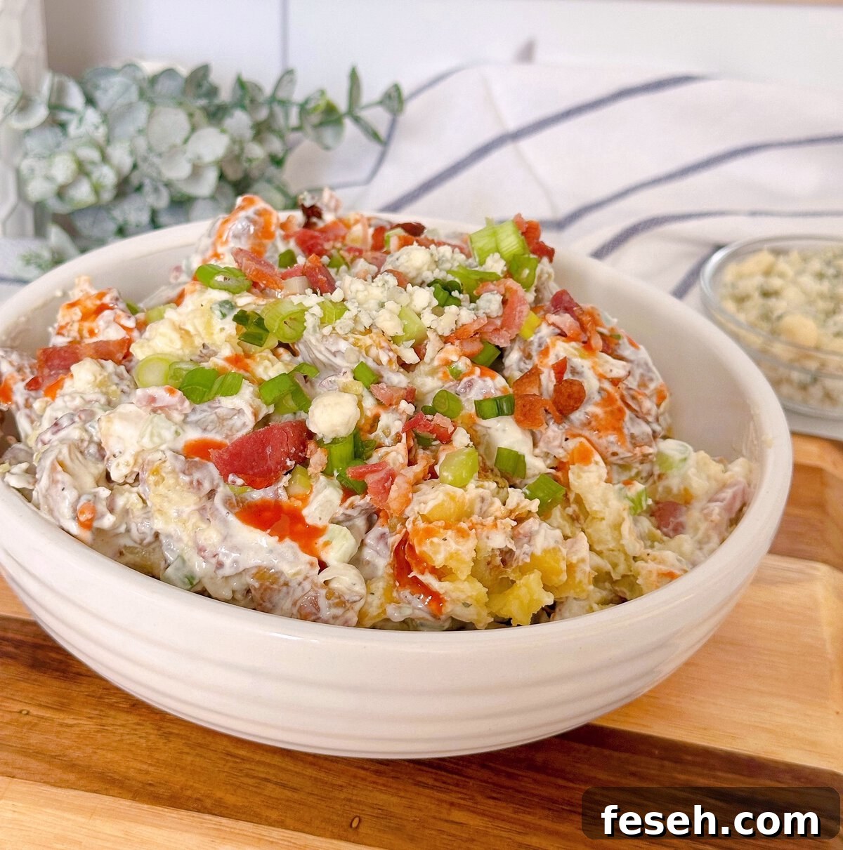 Smashed Crispy Potato Salad in a serving bowl.