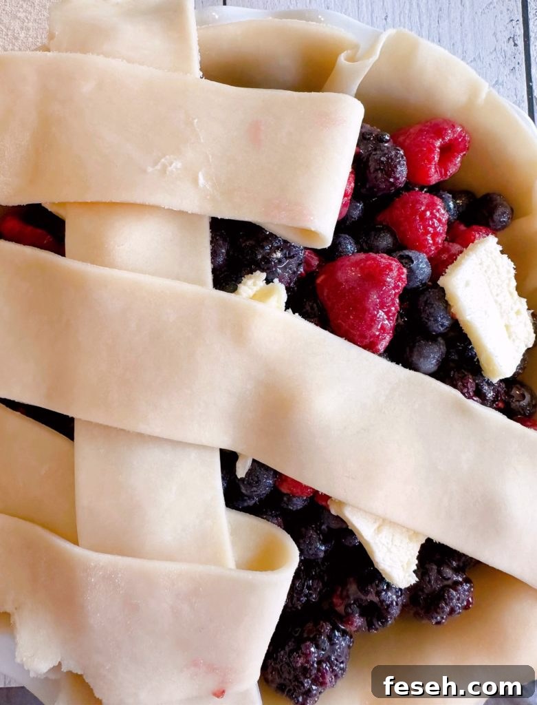 Strips of pie crust laid across the top of the pie for the lattice crust top.