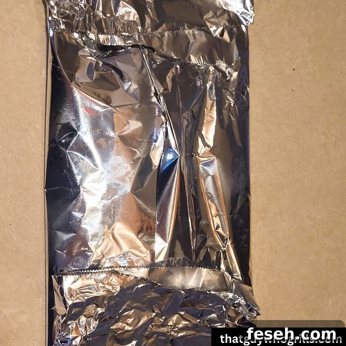 Tilapia seasoned and wrapped in foil to grill