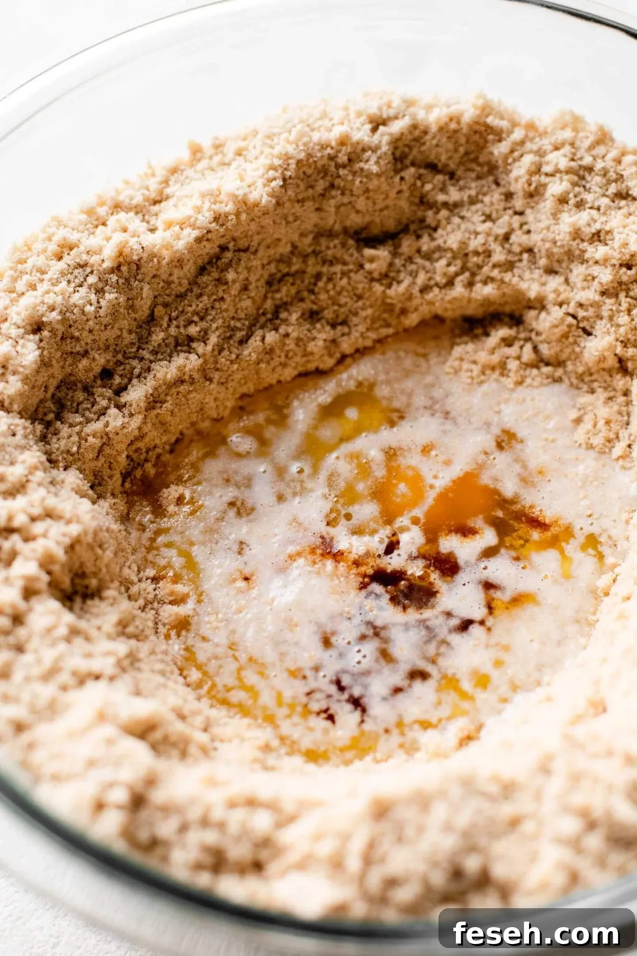 apple crumb muffins wet ingredients for muffin batter combined in well in center of muffins