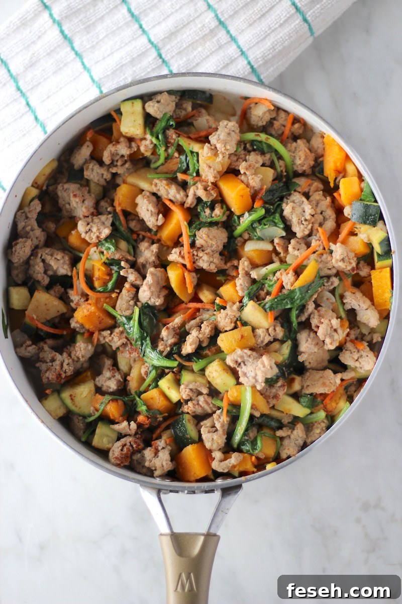 Turkey Apple Breakfast Hash - an AIP breakfast recipe that is full of veggies, ground turkey, and a hint of sweetness from apples, butternut squash, and cinnamon! Awesome for Fall or any time of year! | fedandfulfilled.com