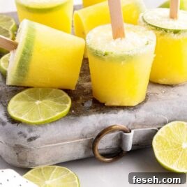 close up shot of Margarita Popsicles with slices of lime