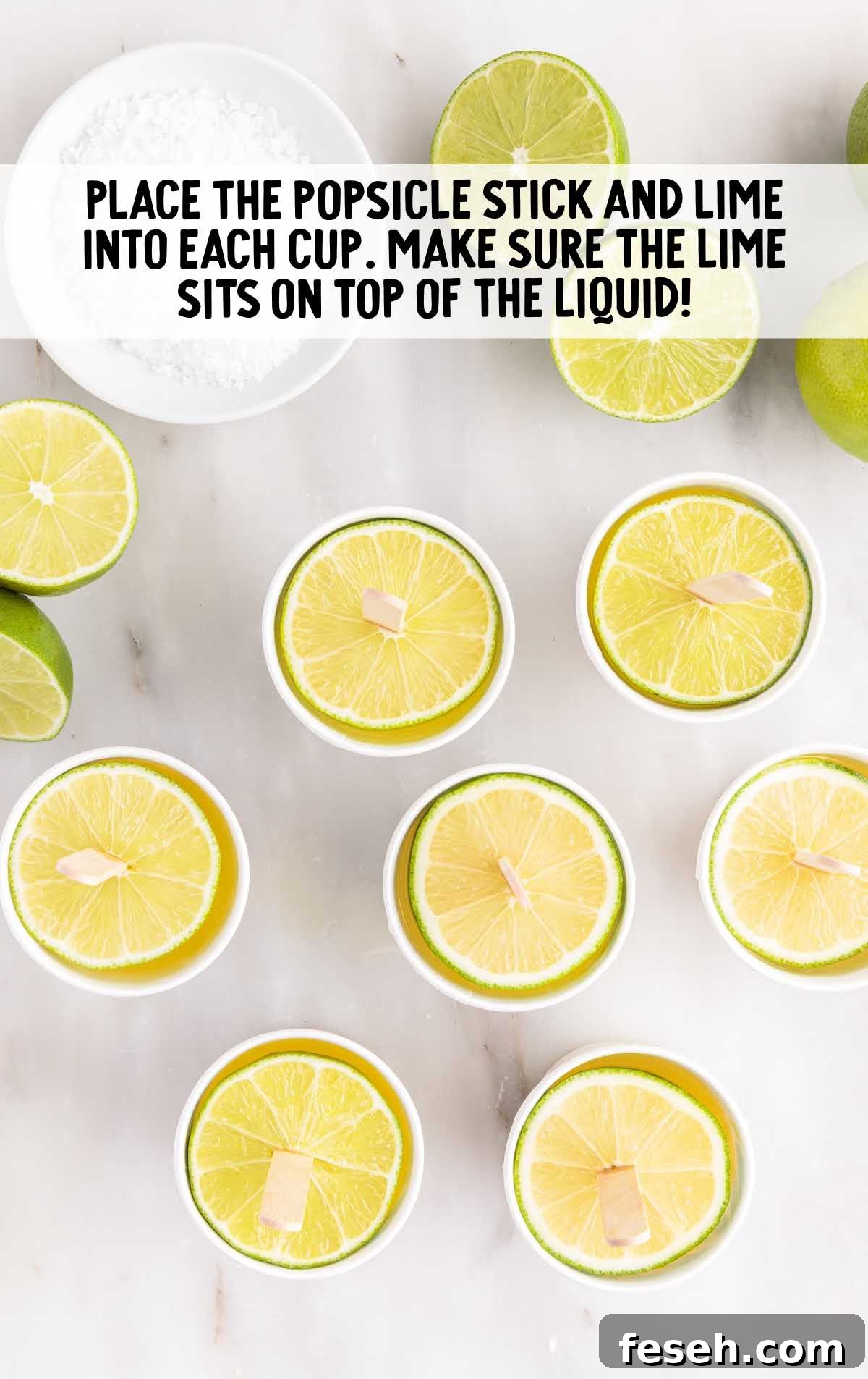 popsicle and lime placed in each cup
