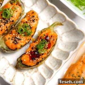 A tempura coated jalapéno with spicy salmon and eel sauce inside.