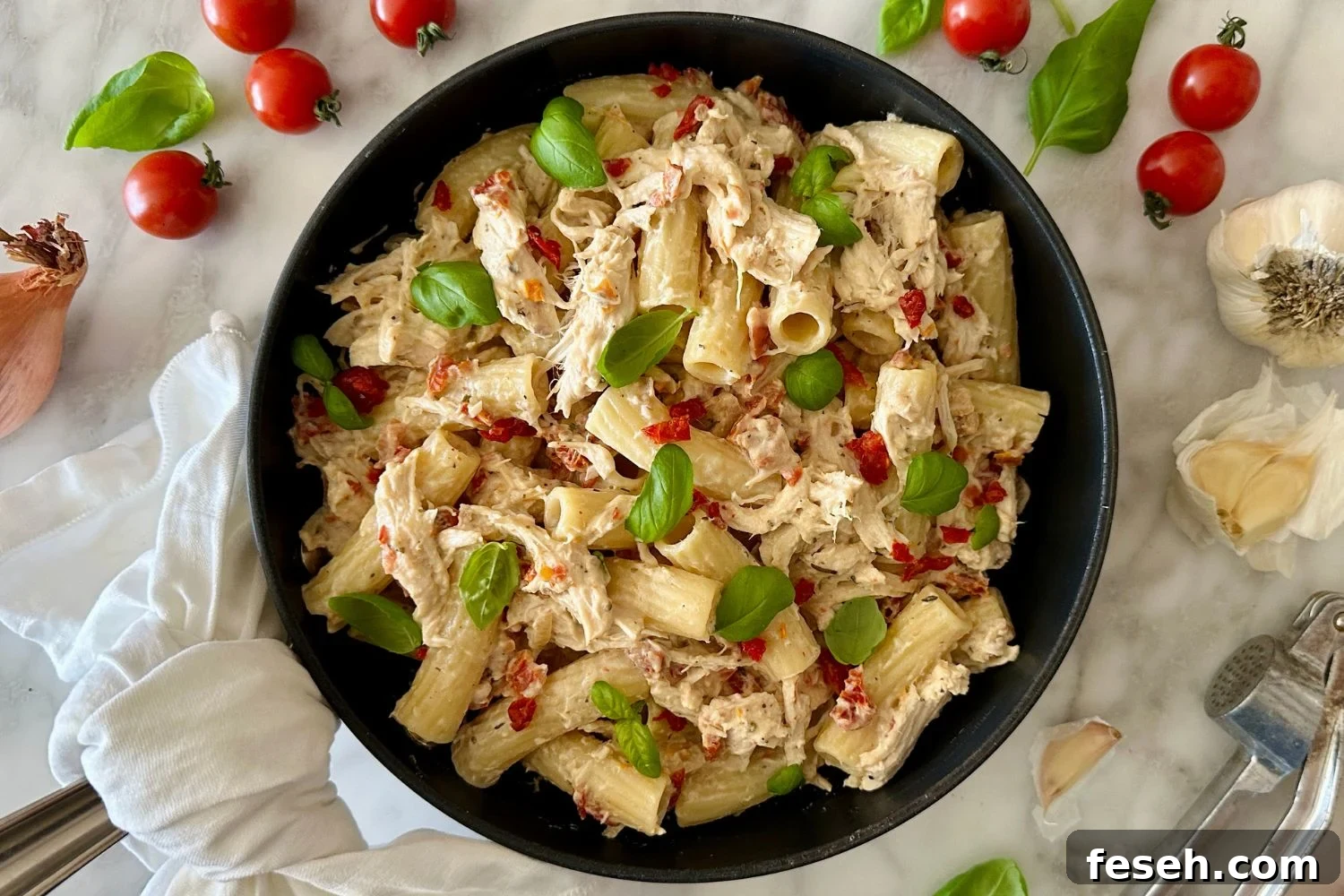 Healthy Marry Me Chicken Pasta served in a pan.