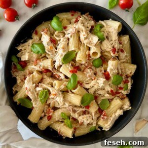 Healthy Marry Me Chicken Pasta served in a pan.