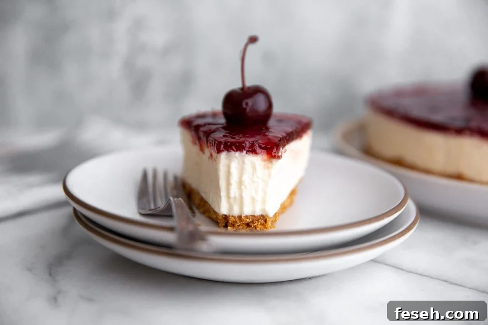 Close-up of a slice of no-bake mascarpone cheesecake on a plate with a fork.