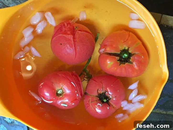 tomatoes in a yellow bowl of ice water