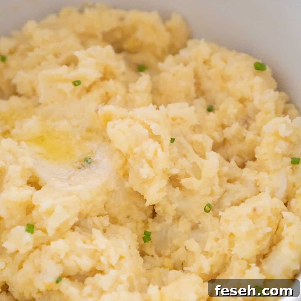 close up of cheesy garlic mashed potatoes