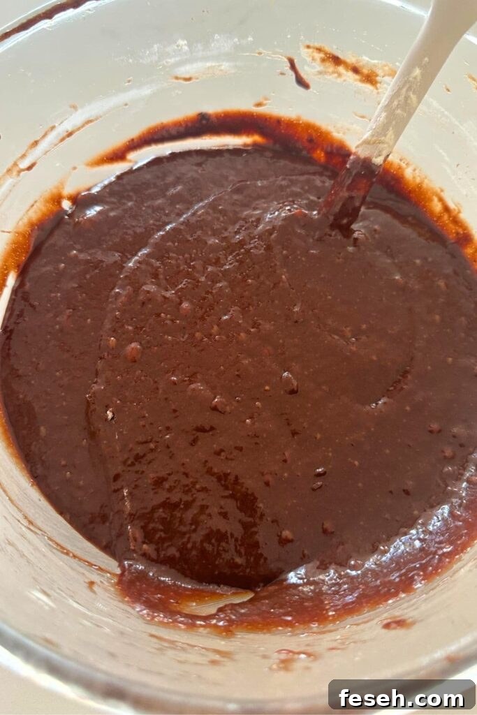 Tray of baked brownie bites cooling.