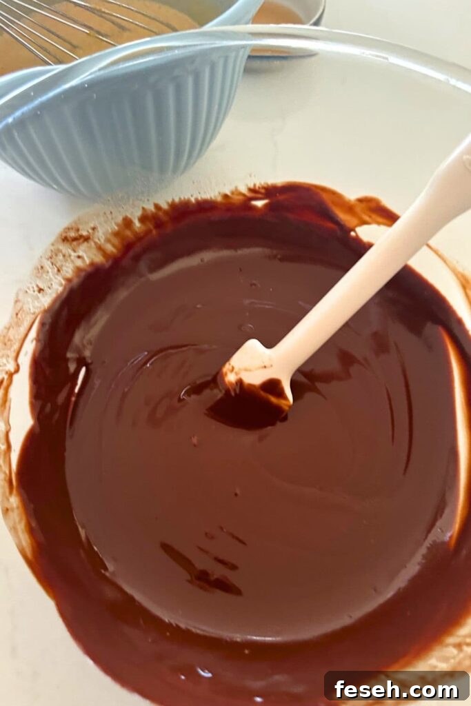 Whisking eggs and sugars.