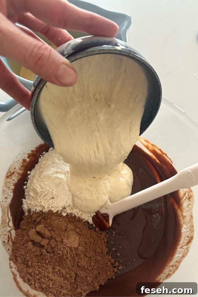 Portioning batter into mini muffin pan.