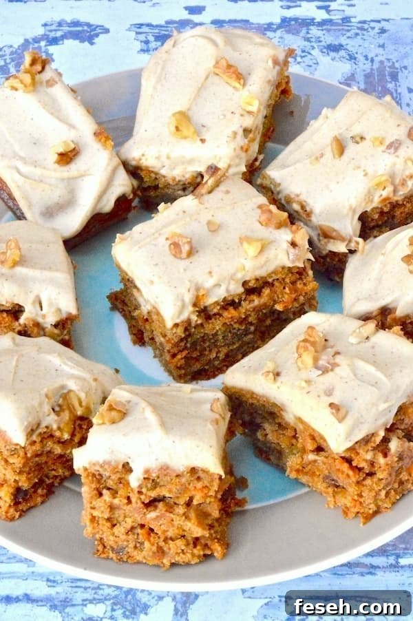 Vegan carrot cake with cashew icing from Tin and Thyme decorated with chopped nuts