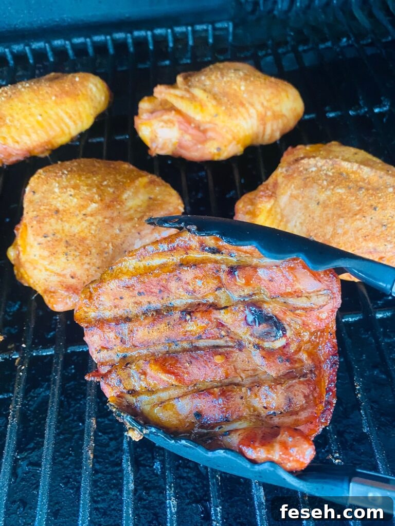 flipping the Smoked Cherry Bourbon Chicken Thighs
