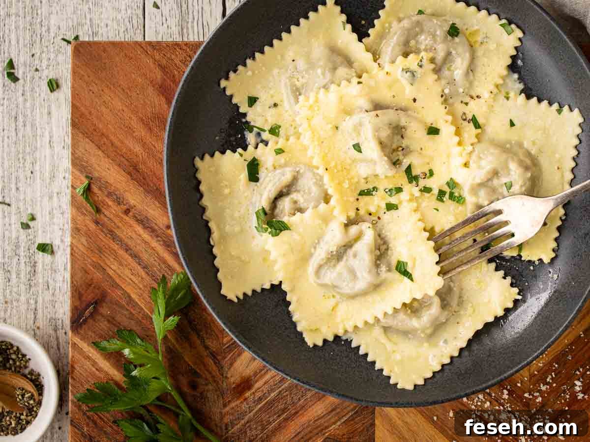 Homemade ravioli in a shallow bowl viewed overhead.