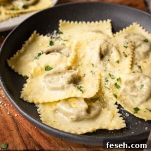 Mushroom Ravioli in a shallow bowl with a sprinkle of chopped parsley