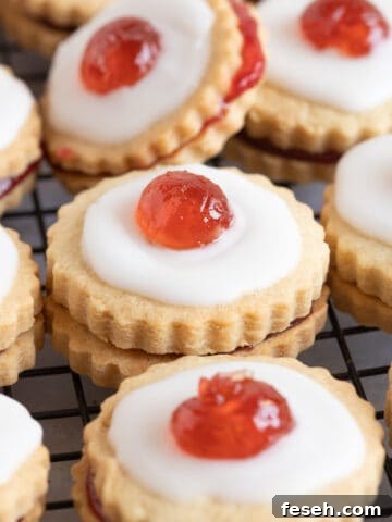Empire biscuits topped with glace cherry.