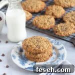 Banana oat and choc chip cookies on a plate.