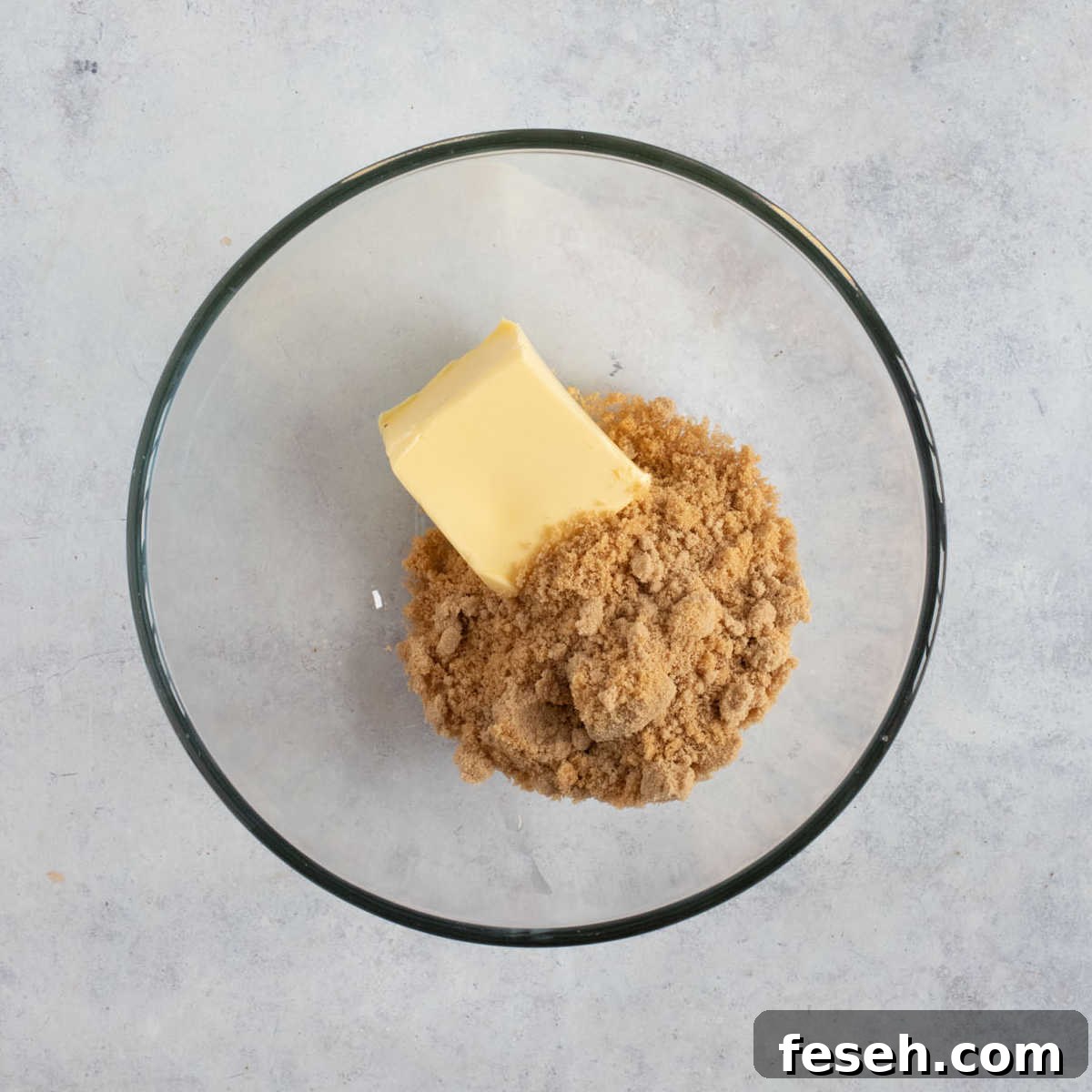 Butter and sugar in a bowl.