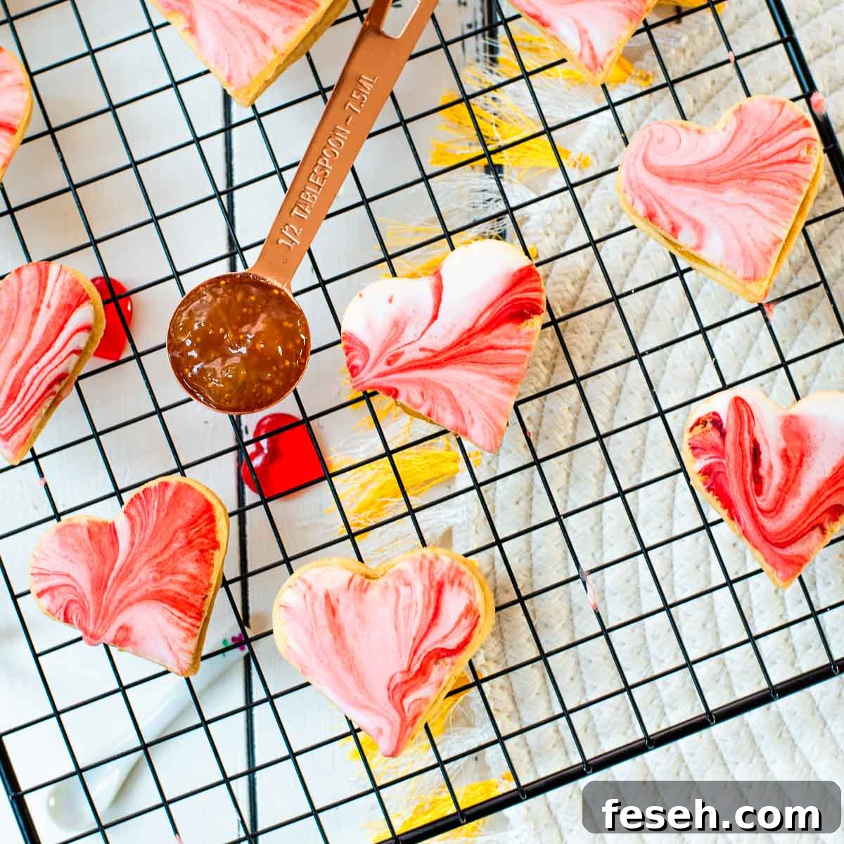 Marbled heart shaped sugar cookies filled with fig jam.