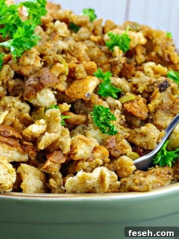 old fashioned turkey stuffing in a green dish with spoon