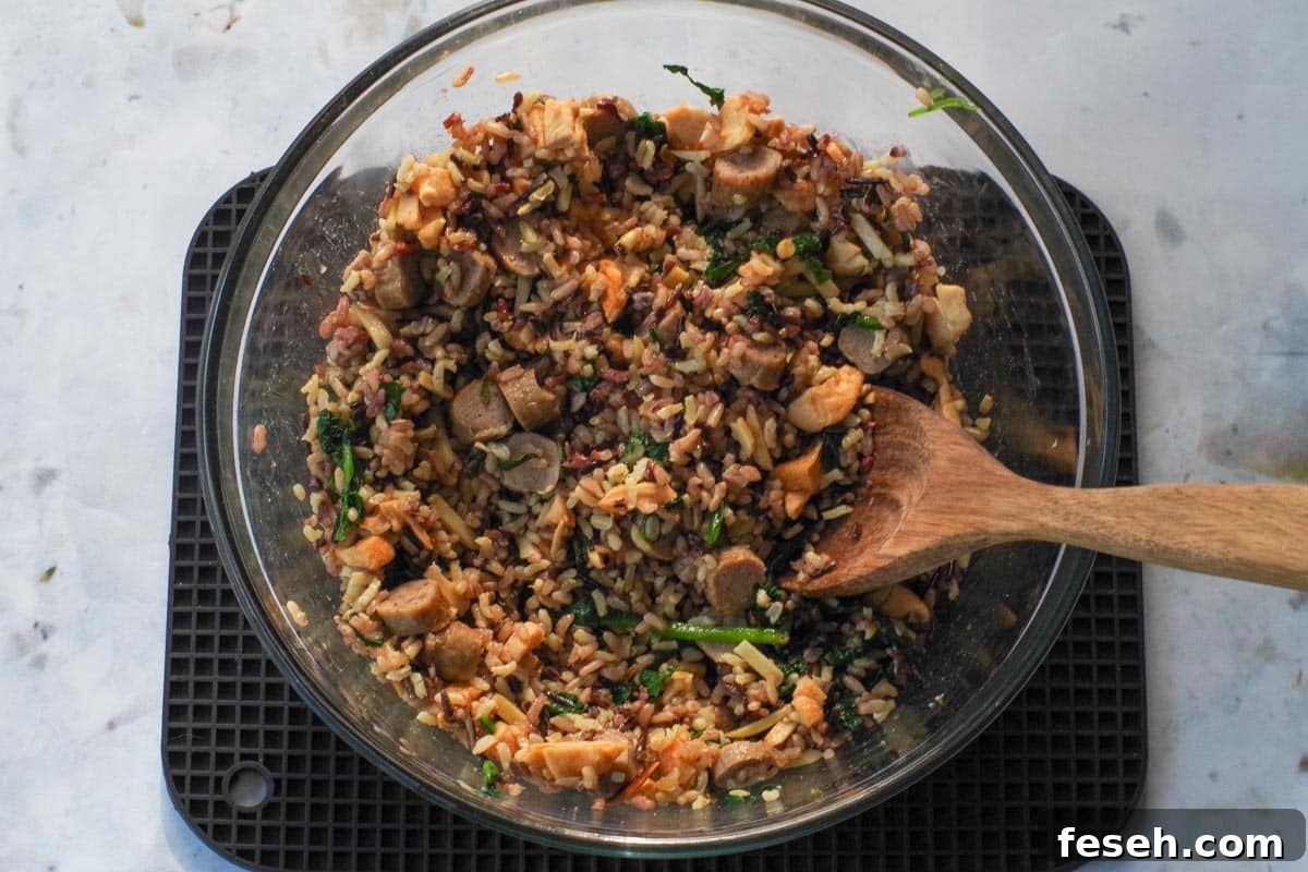 Dried apples and sausage mixed into rice.